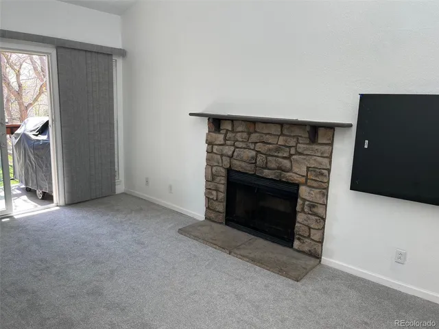 an empty room with a fireplace