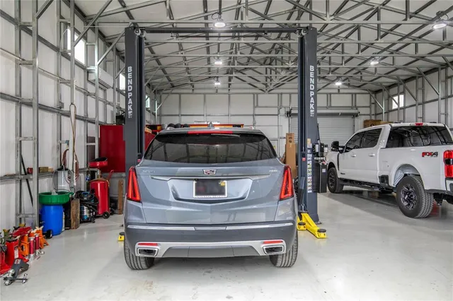 an aerial view of a house with a lake view