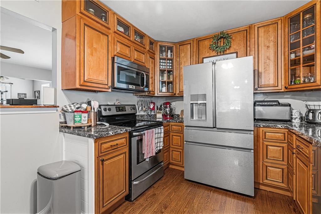 2332 Highway 168 Georgetown, PA 15043 - Photo 7 of 33 a kitchen with stainless steel appliances granite countertop a refrigerator stove microwave and cabinets
