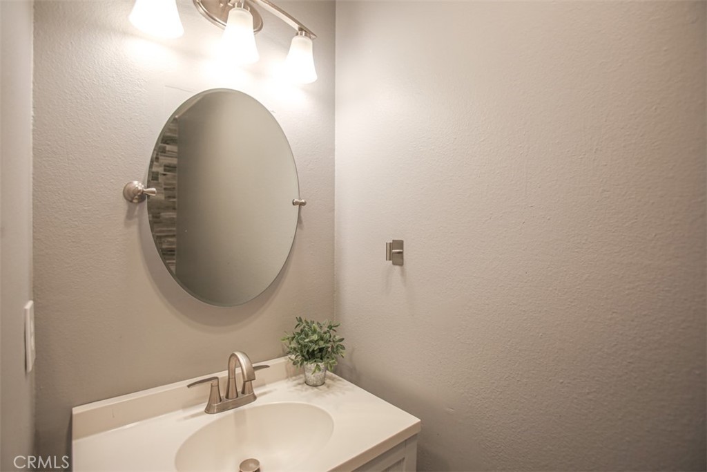 11058 Grant Way Stanton, CA 90680 - Photo 13 of 40 a bathroom with a sink and a mirror