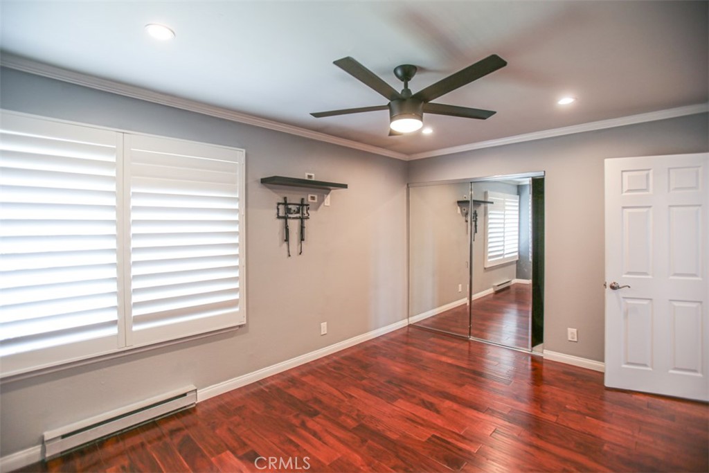11058 Grant Way Stanton, CA 90680 - Photo 19 of 40 a view of a livingroom with a ceiling fan and window