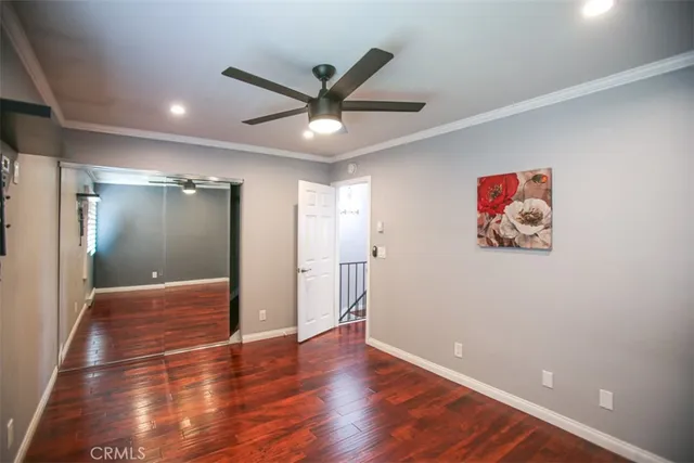 a view of livingroom with hardwood floor and a ceiling fan