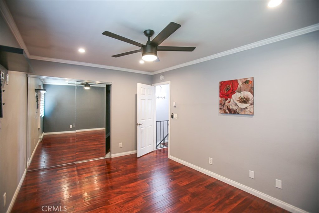 11058 Grant Way Stanton, CA 90680 - Photo 20 of 40 a view of livingroom with hardwood floor and a ceiling fan