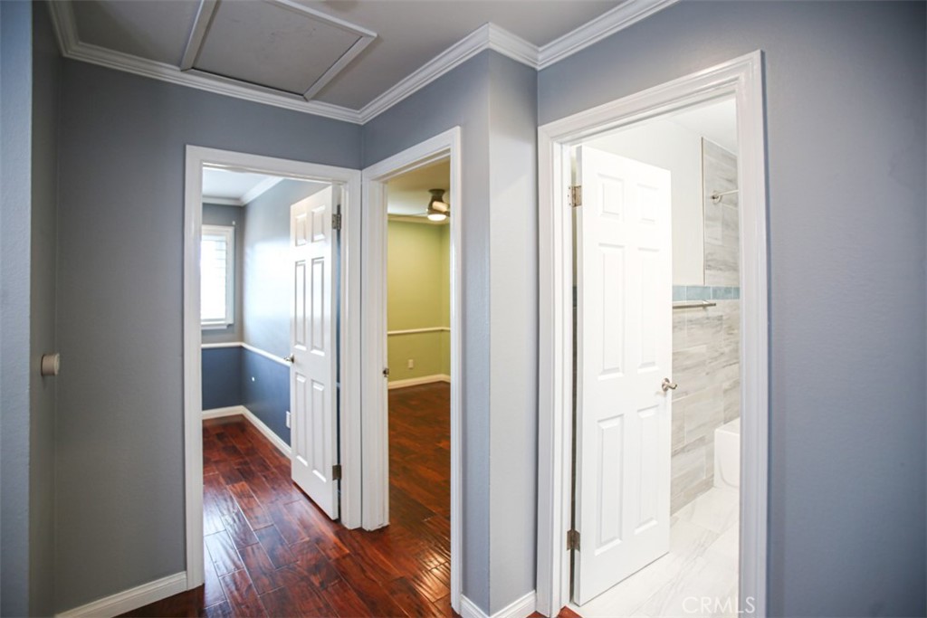 11058 Grant Way Stanton, CA 90680 - Photo 22 of 40 a view of a hallway with wooden floor