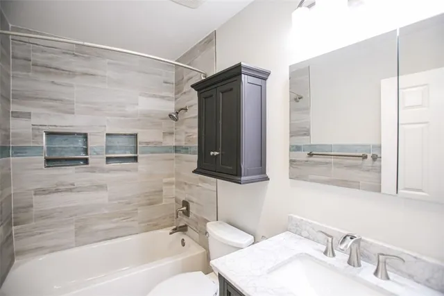 a bathroom with a bathtub and a sink