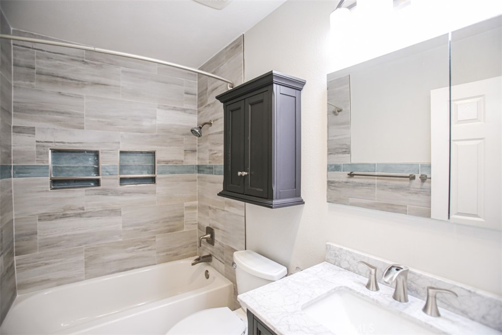 11058 Grant Way Stanton, CA 90680 - Photo 23 of 40 a bathroom with a bathtub and a sink