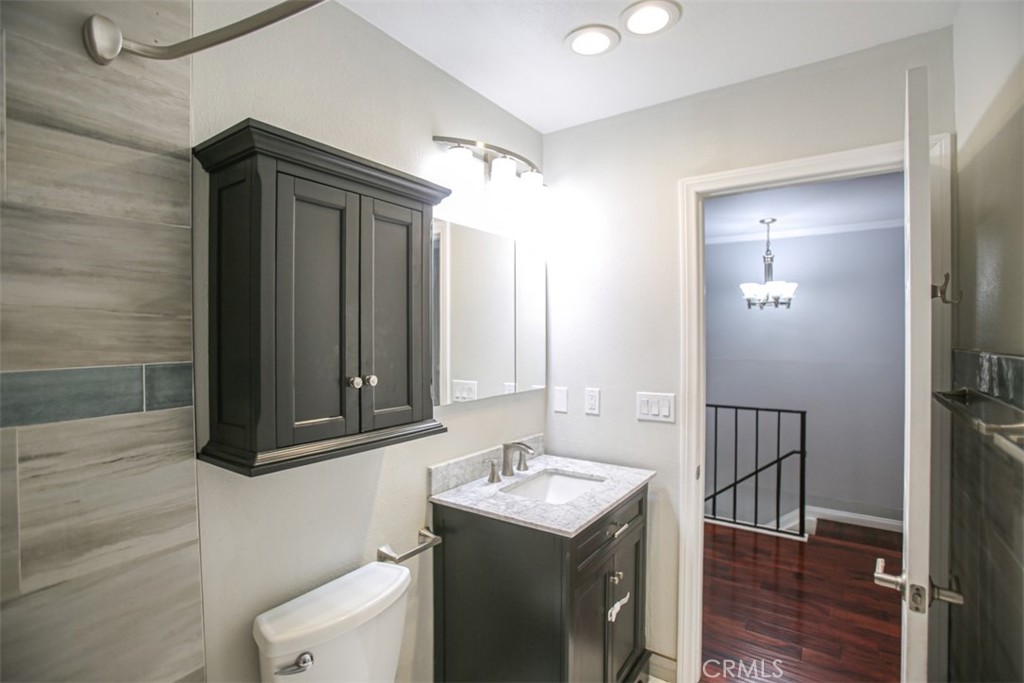 11058 Grant Way Stanton, CA 90680 - Photo 24 of 40 a bathroom with a sink and a mirror