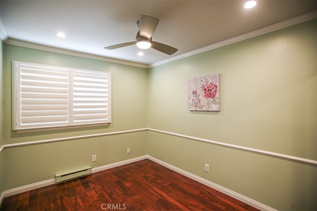 11058 Grant Way Stanton, CA 90680 - Photo 25 of 40 an empty room with a window and ceiling fan