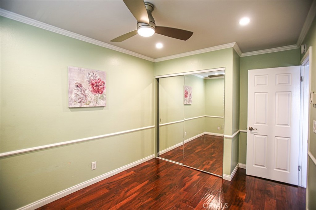 11058 Grant Way Stanton, CA 90680 - Photo 26 of 40 a view of a hallway with wooden floor