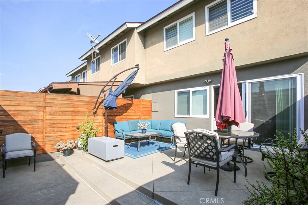 11058 Grant Way Stanton, CA 90680 - Photo 32 of 40 a view of a patio with couches table and chairs and potted plants