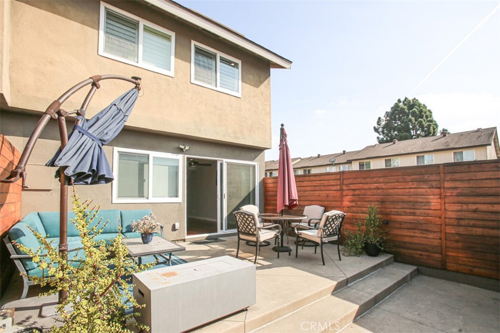 11058 Grant Way Stanton, CA 90680 - Photo 34 of 40 a view of a patio with couches table and chairs and potted plants