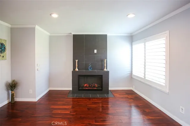 a room with fireplace and wooden floor