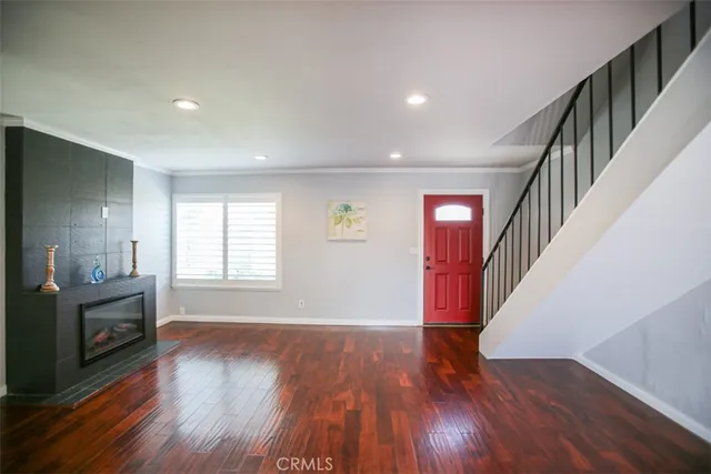a view of livingroom with hardwood and stairs