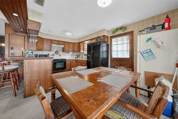 a view of a dining room with furniture