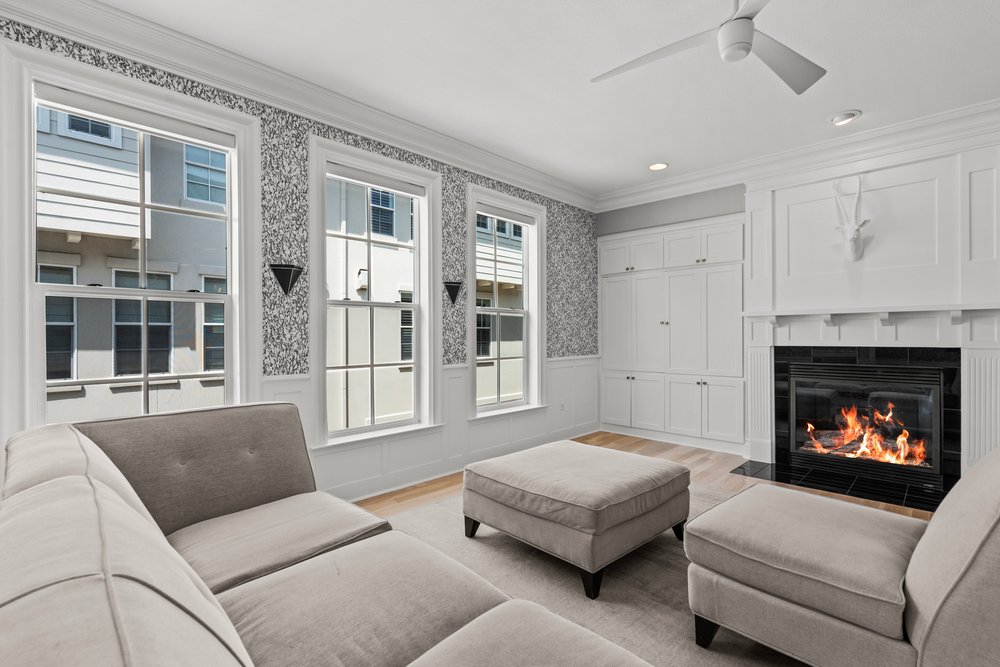 1609 Hartford Road, Unit A Austin, TX 78703 - Photo 13 of 39 A well-appointed living area features a charming fireplace and built-in cabinetry, perfect for cozy gatherings.