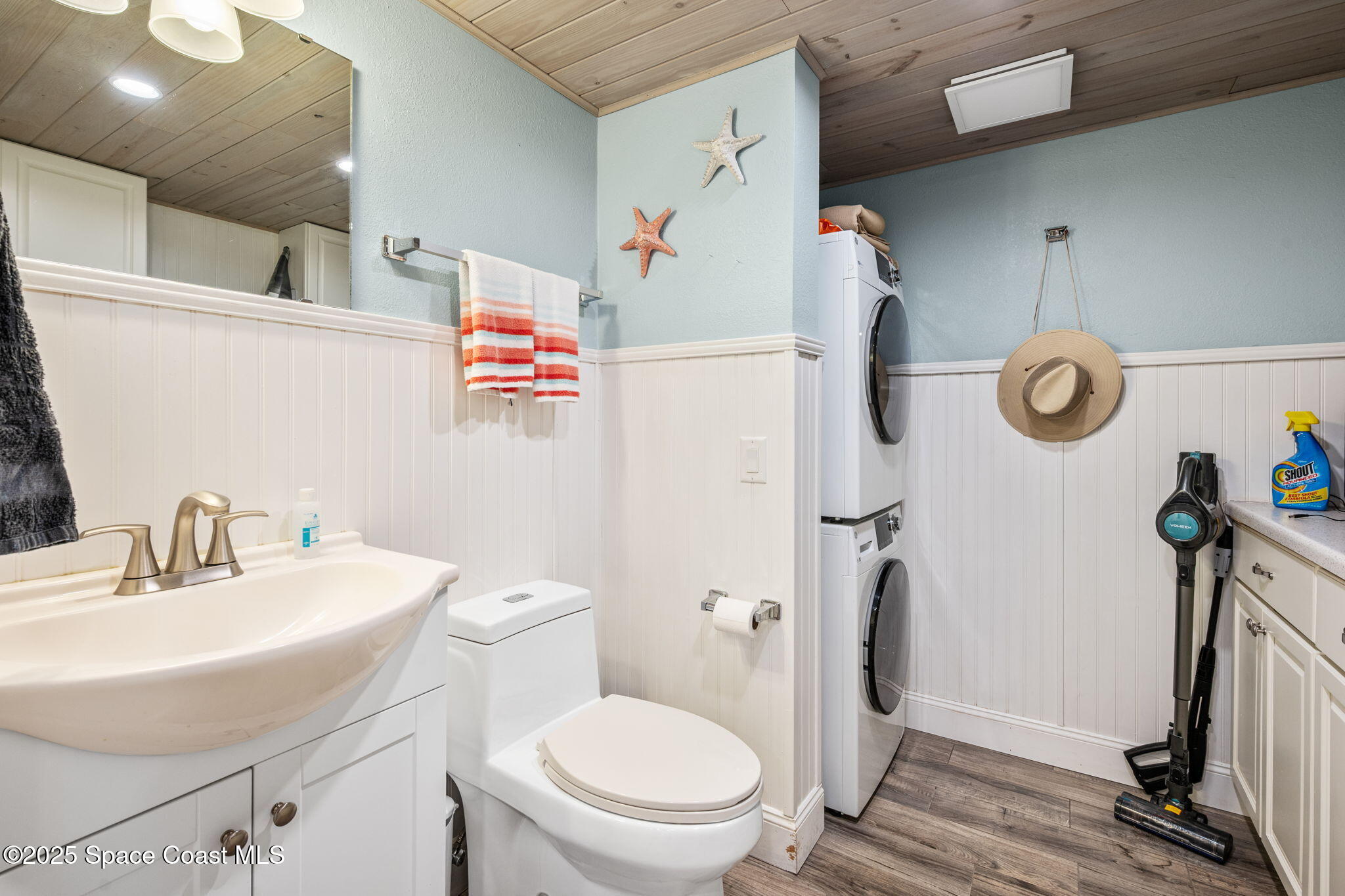 1511 Joshua Drive Northeast Palm Bay, FL 32905 - Photo 12 of 27 a bathroom with a sink a toilet and a mirror