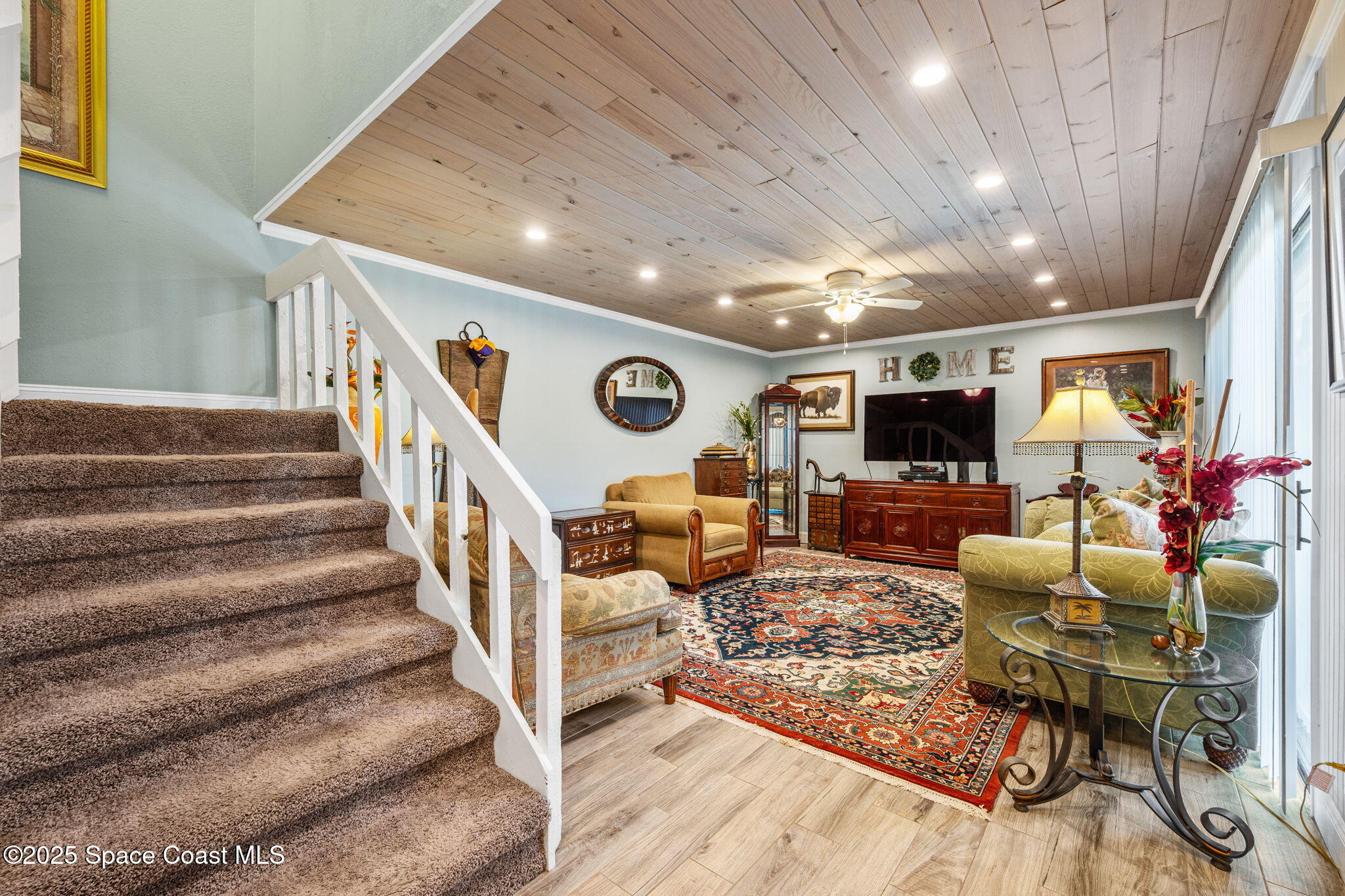 1511 Joshua Drive Northeast Palm Bay, FL 32905 - Photo 13 of 27 a living room with furniture and a flat screen tv