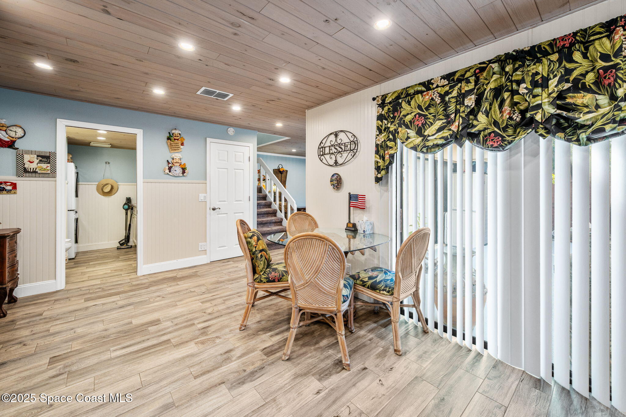 1511 Joshua Drive Northeast Palm Bay, FL 32905 - Photo 6 of 27 a dining room with furniture and a rug