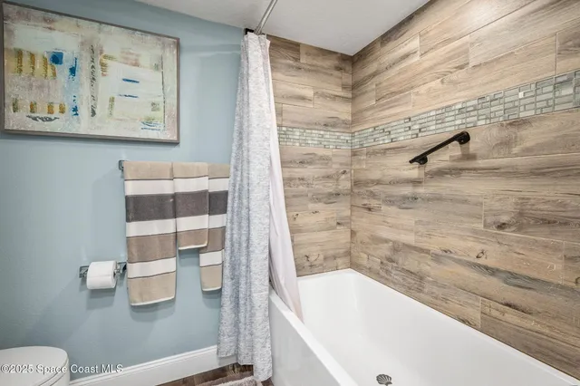 a bathroom with a sink vanity and a mirror