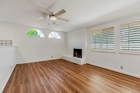 a bathroom with a sink mirror and toilet