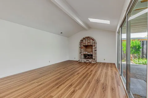 a bedroom with a bed and flat screen tv