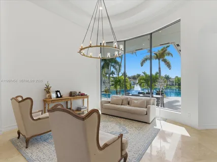 a bedroom with a bed and a ceiling fan