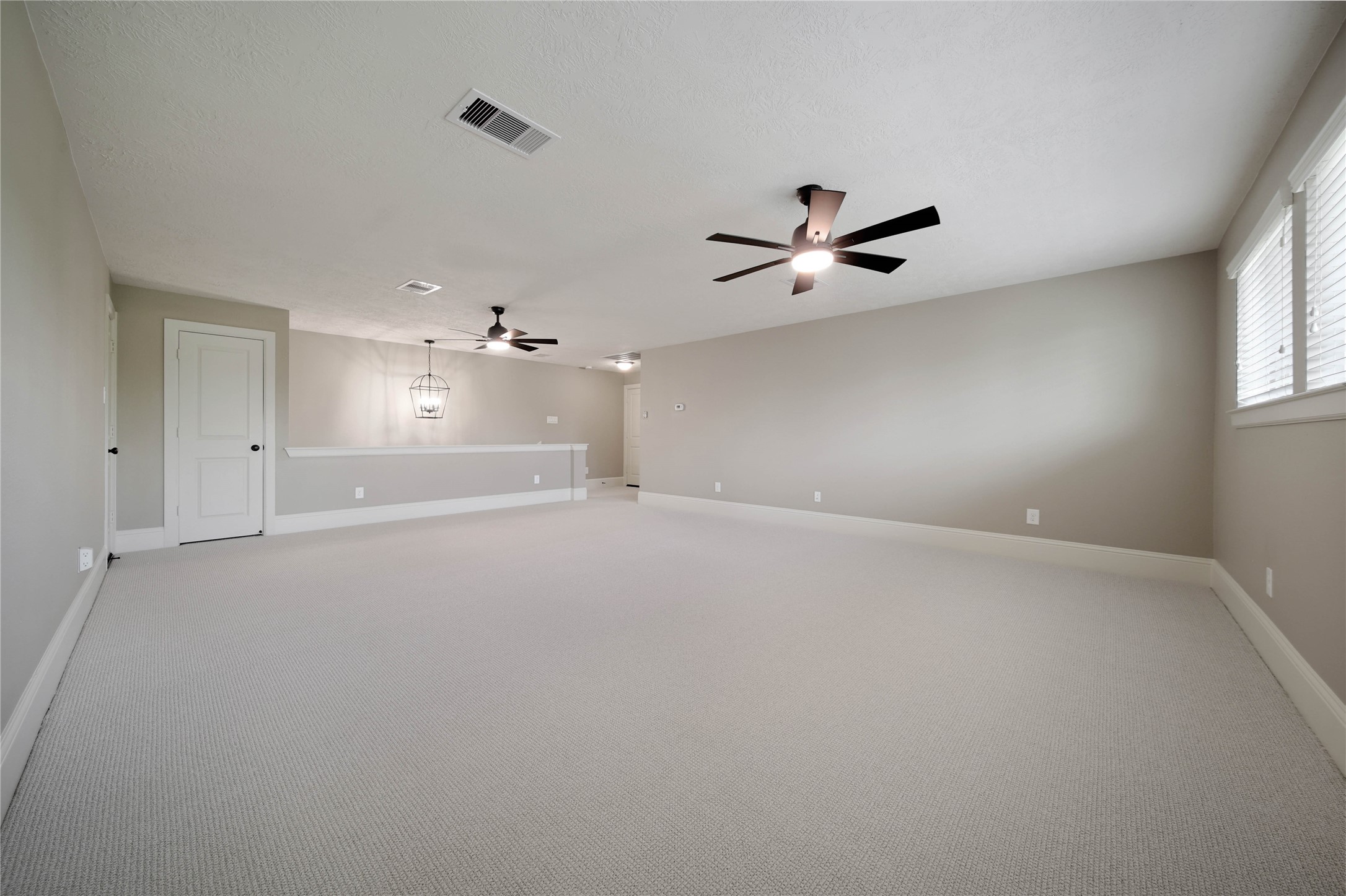 1215 Jake Springs Court Spring, TX 77386 - Photo 28 of 49 The carpet is new and incredibly soft! Enjoy endless possibilities in this space...room for a pool table, media room, more space for the kiddos to play, or maybe a craft room.