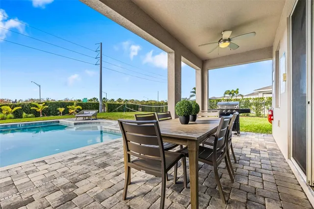 a view of a dining room with furniture window and outside view