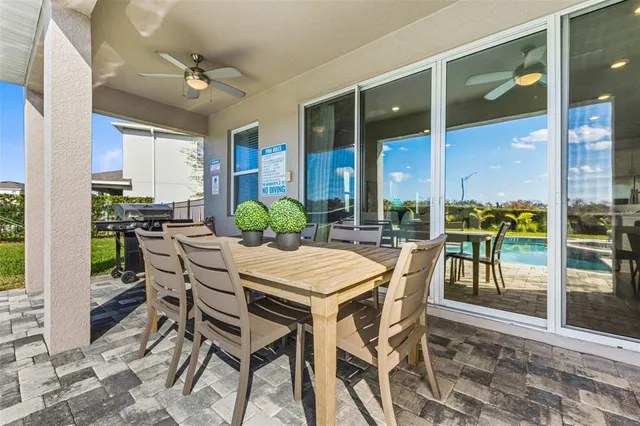 a view of a swimming pool with lawn chairs