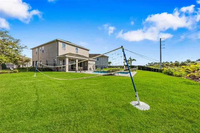 a living room with furniture a couch and a chandelier