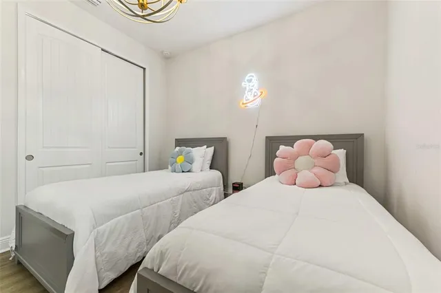 a bathroom with a double vanity sink mirror and shower