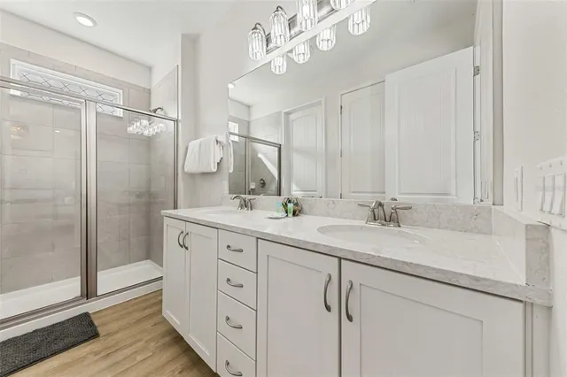 a front view of multi story residential apartment building with yard and sign board