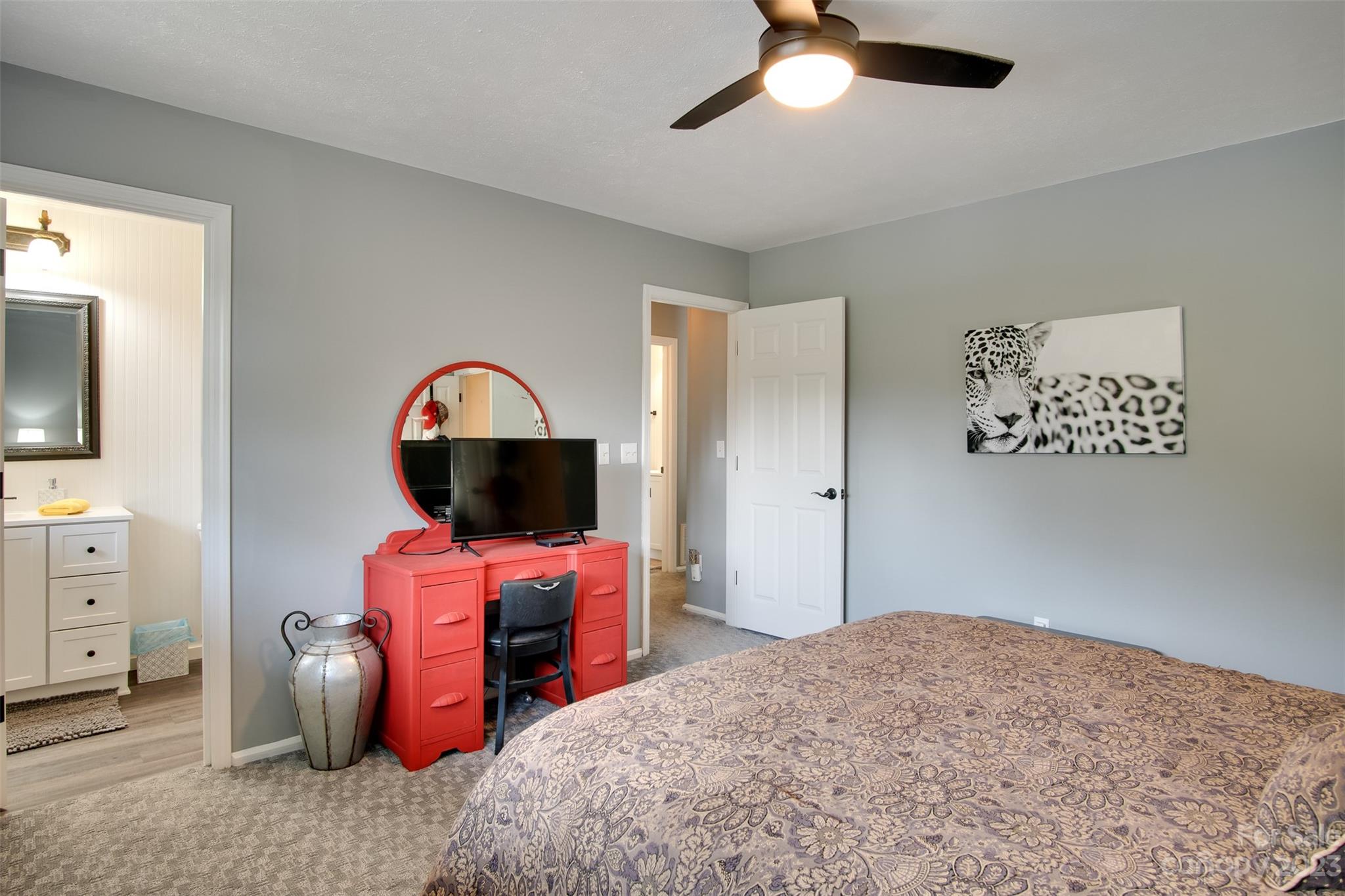 209 Emerald Hill Road Franklin, NC 28734 - Photo 11 of 33 a bedroom with a bed and a chandelier