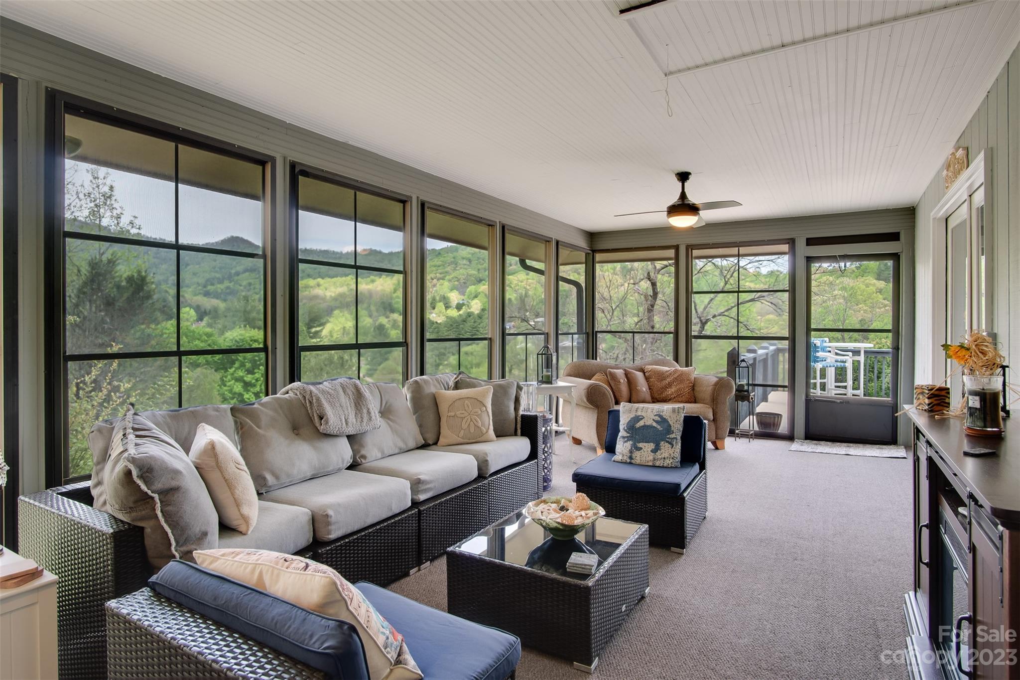 209 Emerald Hill Road Franklin, NC 28734 - Photo 12 of 33 a living room with furniture and floor to ceiling windows