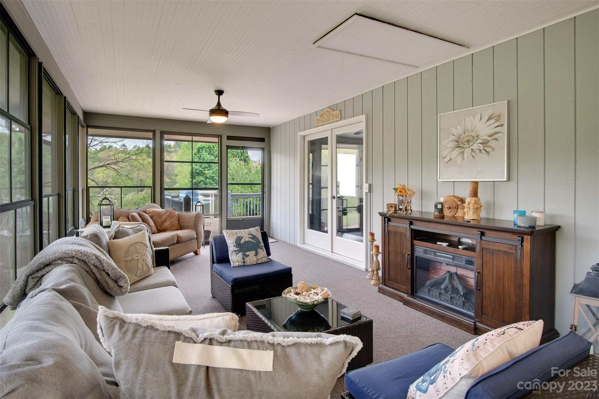209 Emerald Hill Road Franklin, NC 28734 - Photo 14 of 33 a living room with furniture and a fireplace