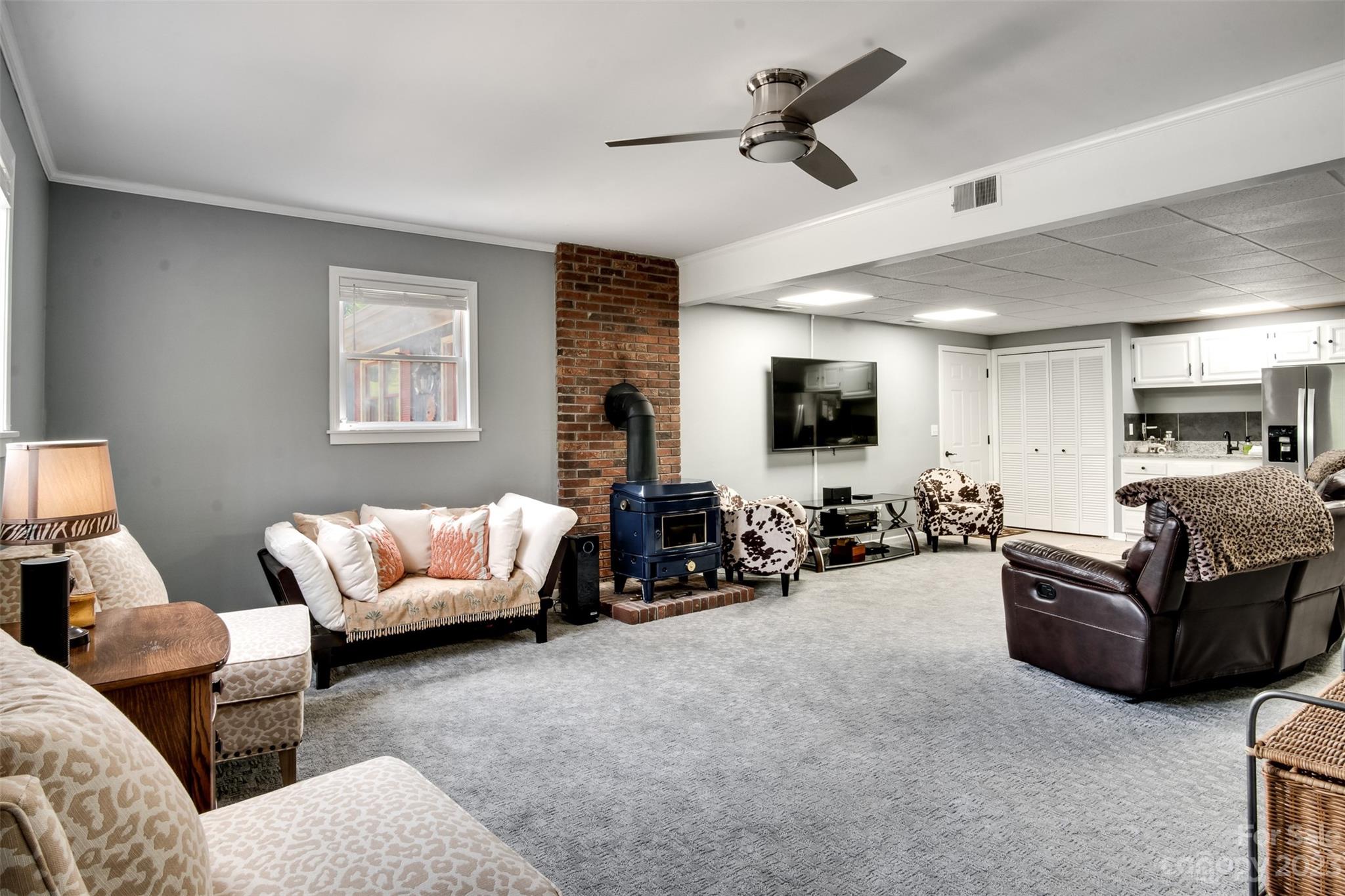 209 Emerald Hill Road Franklin, NC 28734 - Photo 15 of 33 a living room with furniture and a flat screen tv