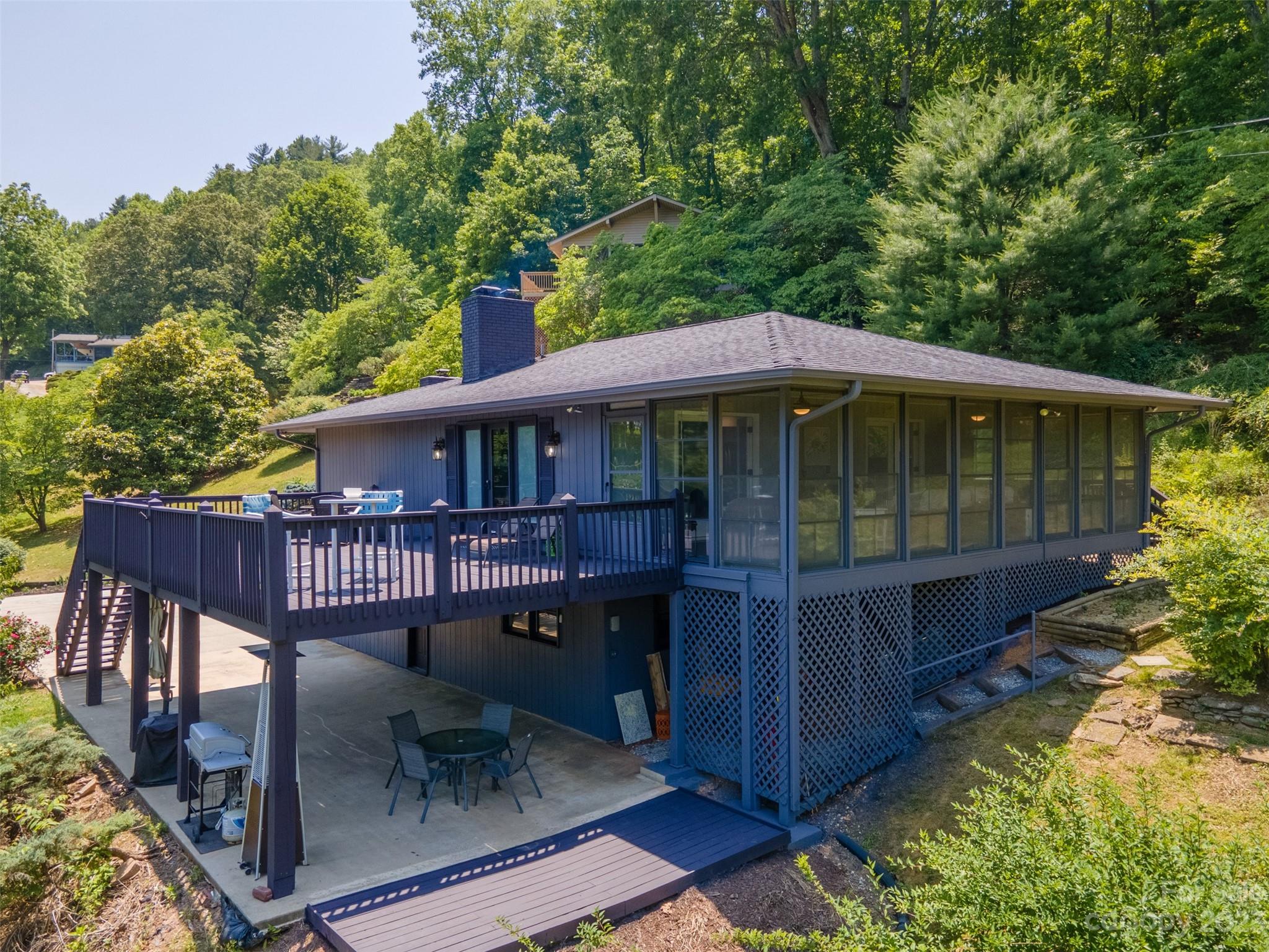 209 Emerald Hill Road Franklin, NC 28734 - Photo 2 of 33 a view of a house with backyard porch and sitting area