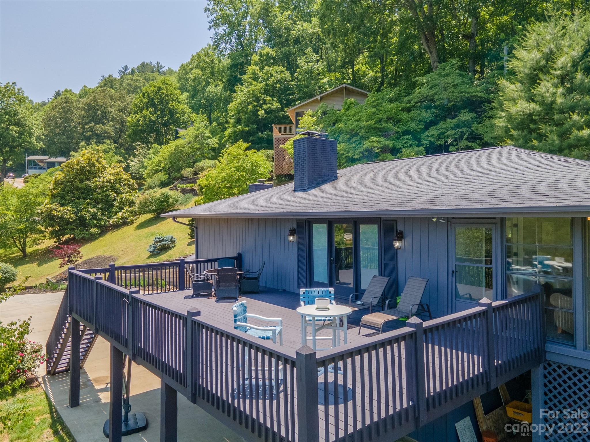 209 Emerald Hill Road Franklin, NC 28734 - Photo 21 of 33 a view of a house with backyard and sitting area