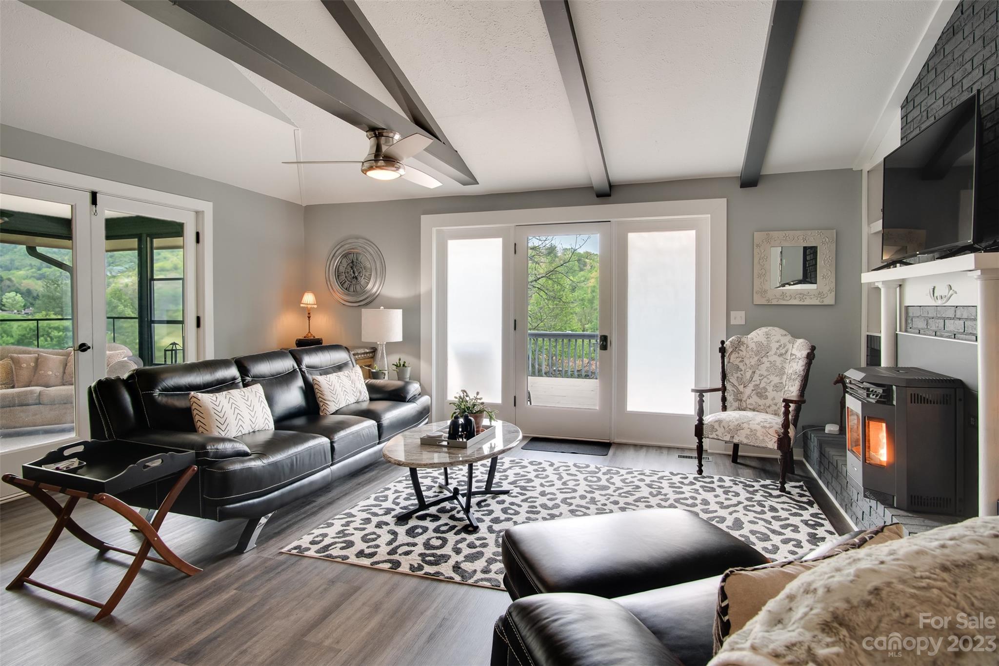 209 Emerald Hill Road Franklin, NC 28734 - Photo 3 of 33 a living room with furniture fireplace and flat screen tv