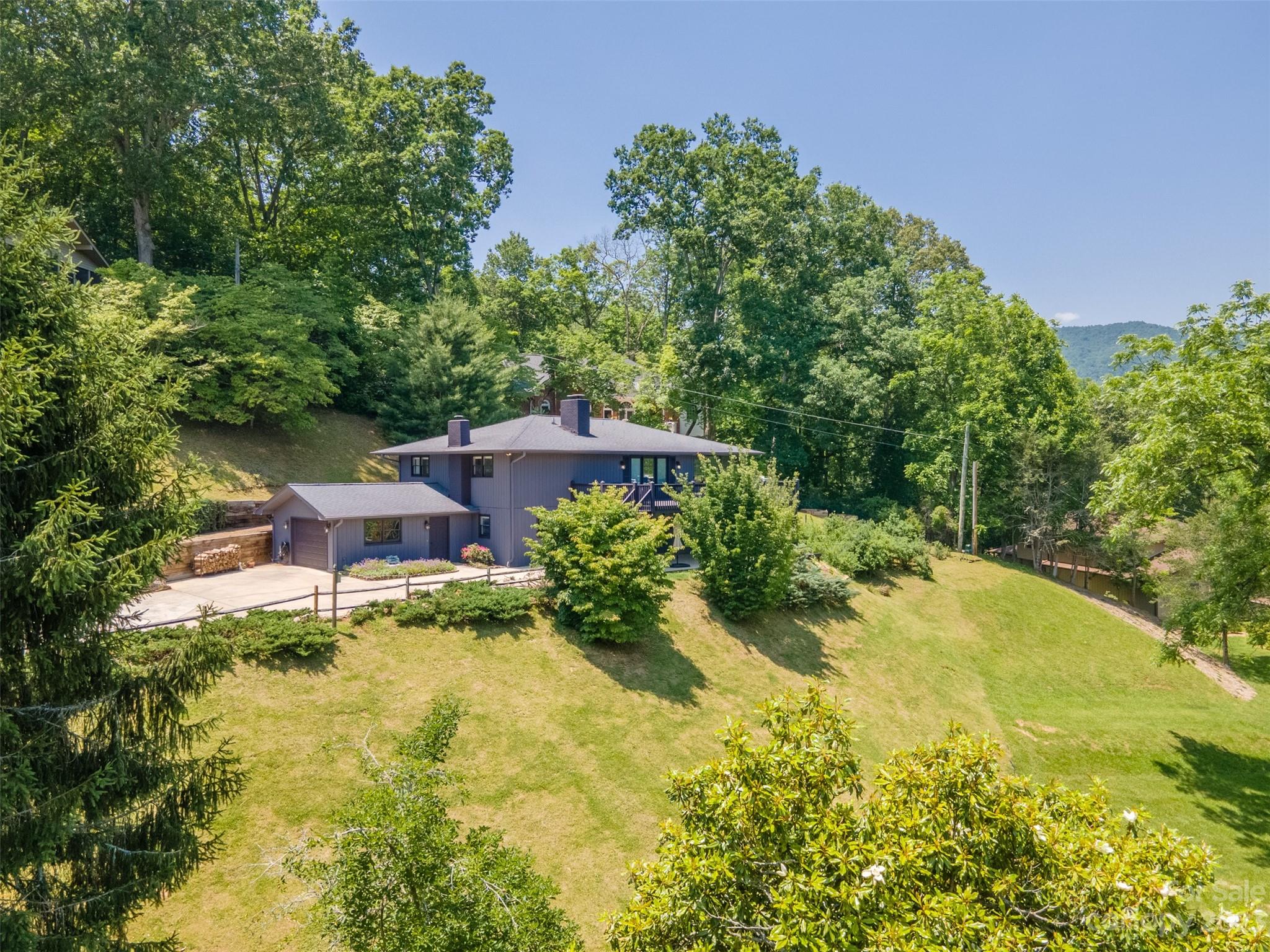 209 Emerald Hill Road Franklin, NC 28734 - Photo 32 of 33 a backyard of a house with yard and outdoor seating