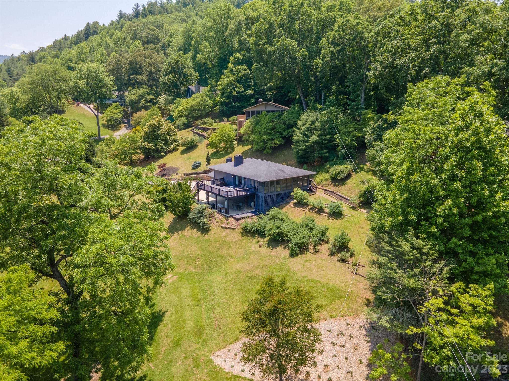 209 Emerald Hill Road Franklin, NC 28734 - Photo 33 of 33 a view of a garden with a house