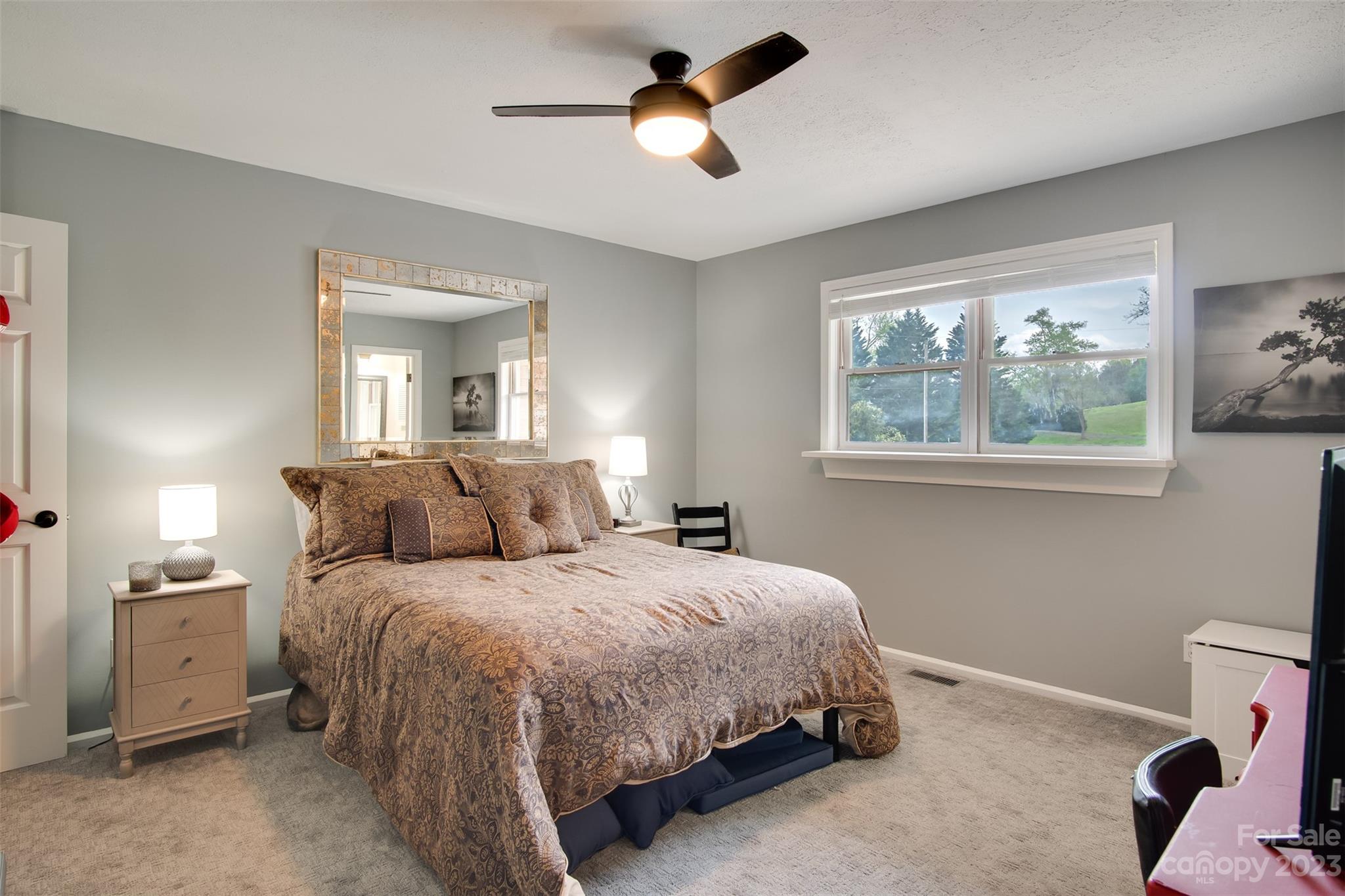 209 Emerald Hill Road Franklin, NC 28734 - Photo 10 of 33 a bedroom with a bed and window