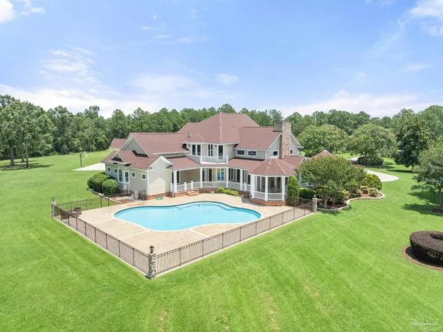 a view of a house with a big yard