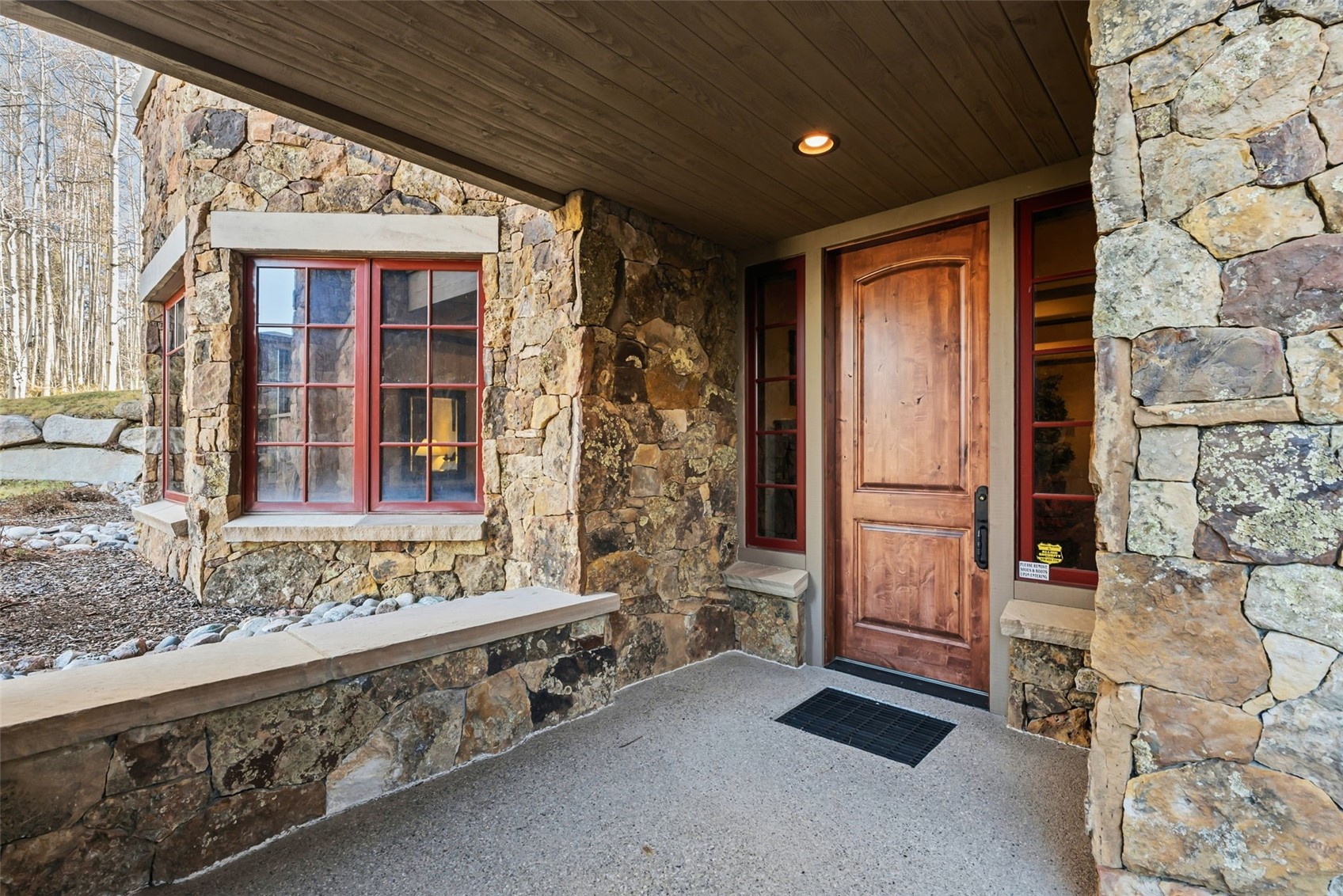 2140 Hunter's Knob Road Silverthorne, CO 80498 - Photo 44 of 46 View of exterior entry with stone siding and a porch