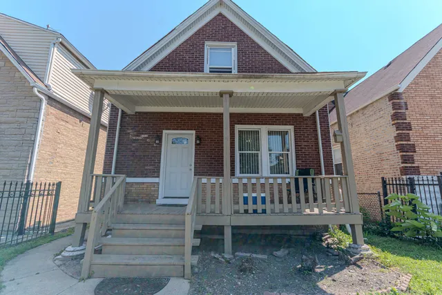 a view of front door of house with stairs