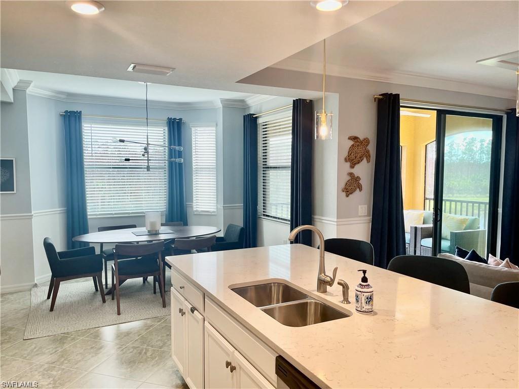 9590 Trevi Court, Unit 5337 Naples, FL 34113 - Photo 12 of 35 a spacious bathroom with a tub sink and mirror