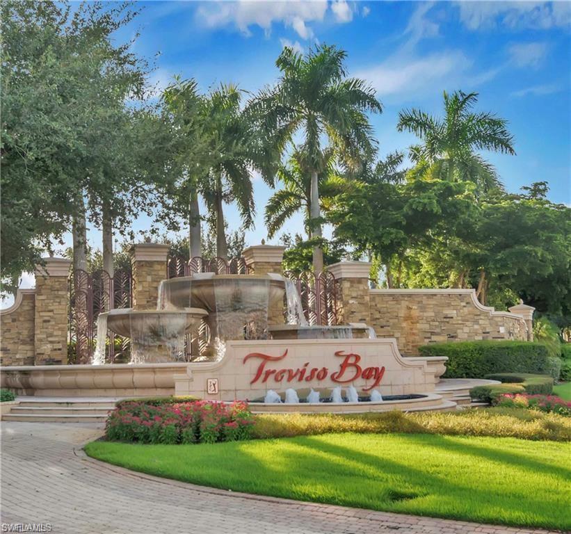 9590 Trevi Court, Unit 5337 Naples, FL 34113 - Photo 2 of 35 a sign that is sitting on the side of the road