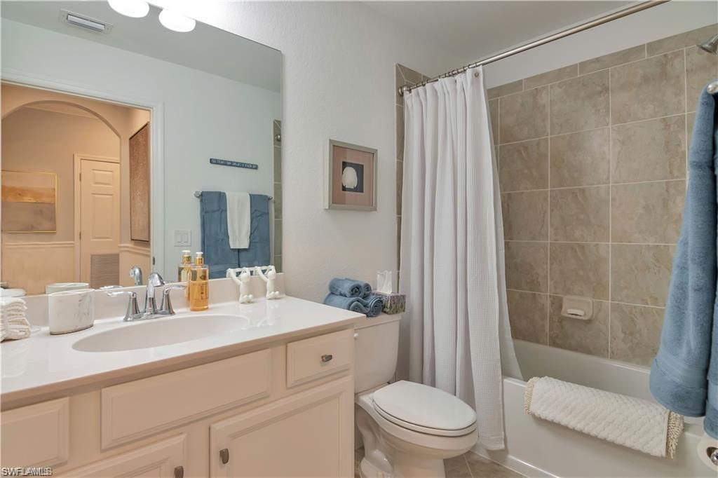9590 Trevi Court, Unit 5337 Naples, FL 34113 - Photo 22 of 35 a bathroom with a sink a toilet and shower