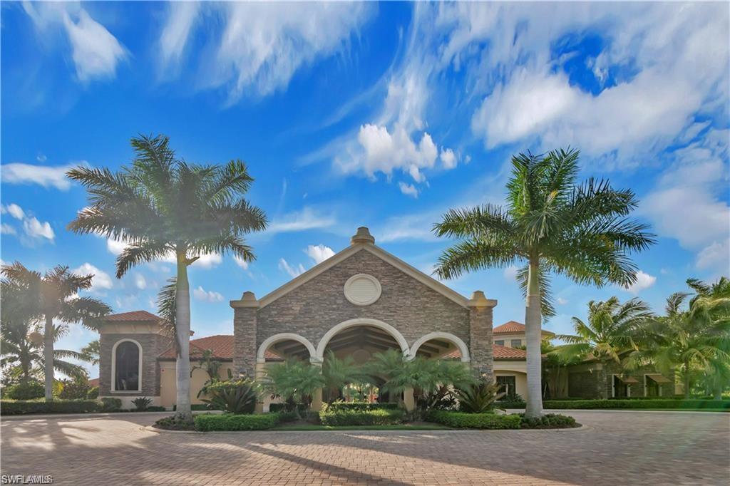 9590 Trevi Court, Unit 5337 Naples, FL 34113 - Photo 25 of 35 a front view of a house with a yard