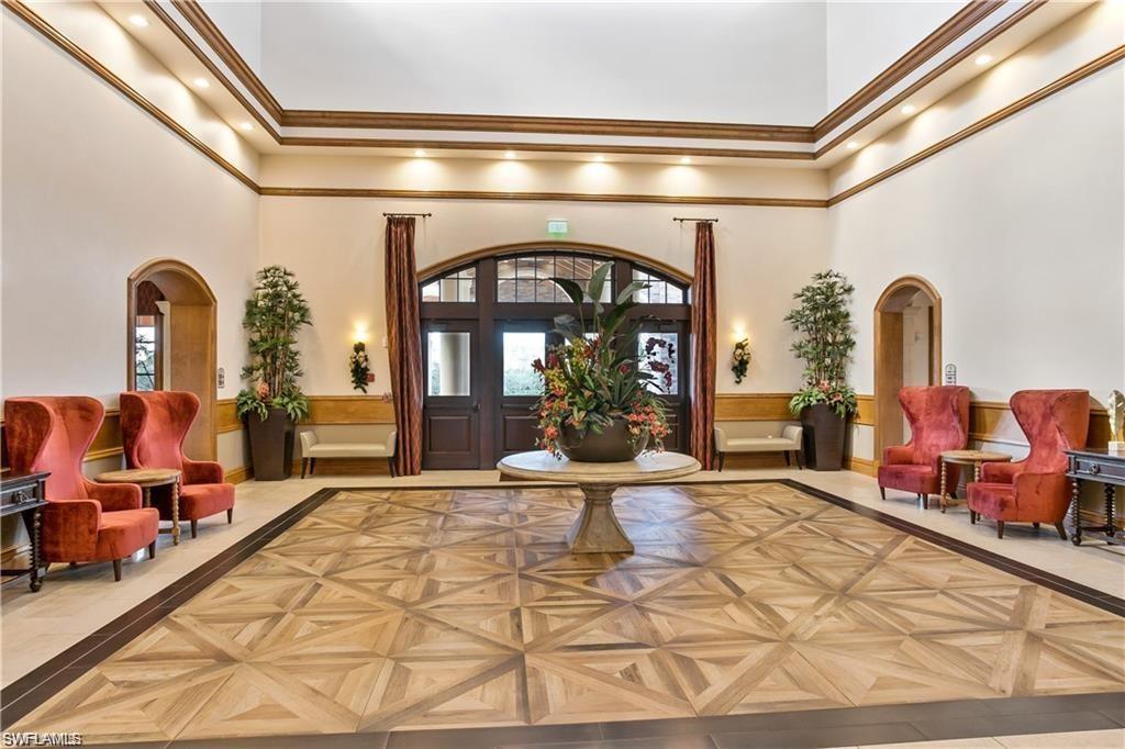 9590 Trevi Court, Unit 5337 Naples, FL 34113 - Photo 26 of 35 a living room with furniture